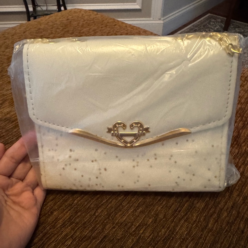 Elegant White Handbag with Gold Accents